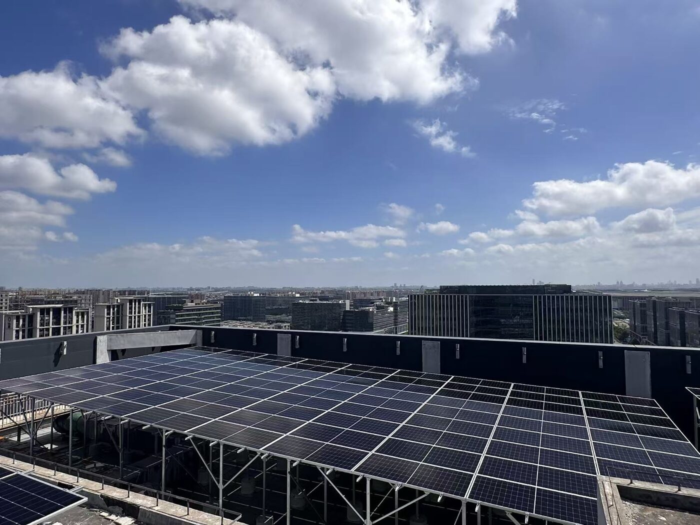 Rooftop solar array with the Shanghai skyline behind